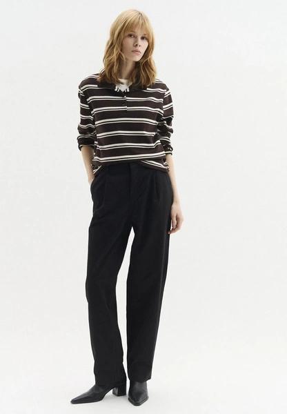 Черные брюки на низкой посадке: тренд Balenciaga весна-лето 2026